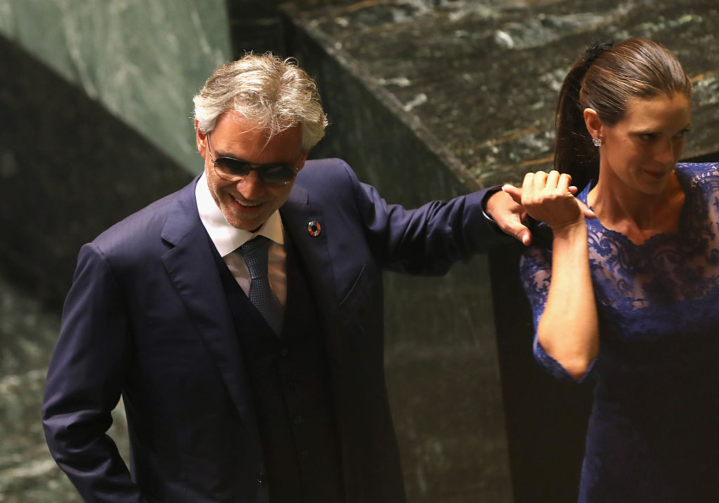 NEW YORK, NY - SEPTEMBER 20:  Italian tenor Andrea Bocelli, who has been blind since childhood, is escorted after singing 